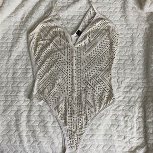 White and gold body suit